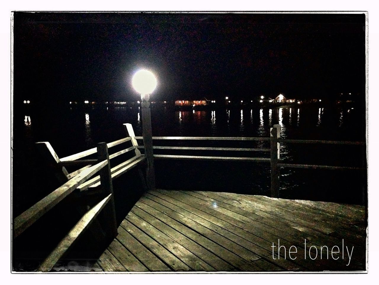 transfer print, auto post production filter, night, illuminated, empty, railing, transportation, built structure, street light, absence, the way forward, text, architecture, outdoors, no people, western script, city, lighting equipment, bench, sidewalk