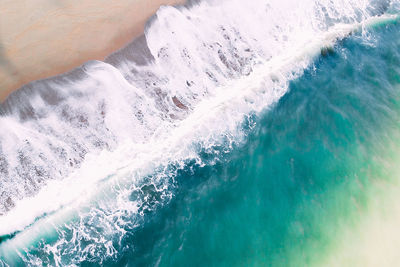 High angle view of water splashing in sea