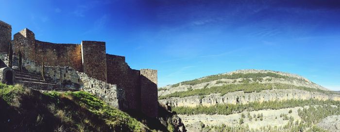 Ancient structure against blue sky