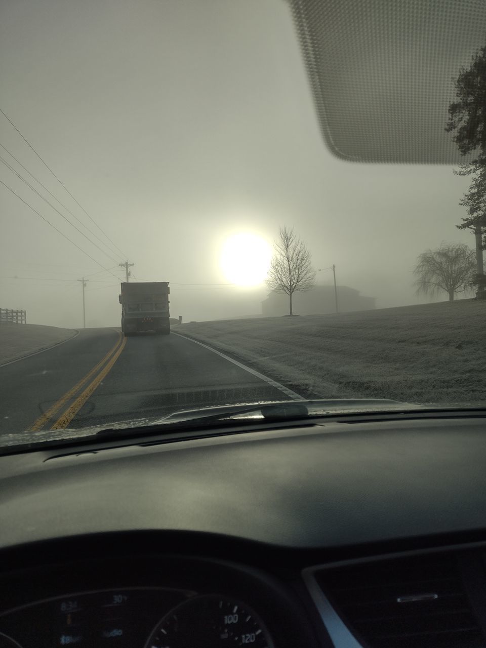 transportation, mode of transportation, fog, light, no people, tree, darkness, land vehicle, car, nature, motor vehicle, black, sky, travel, white, rail transportation, outdoors, architecture, public transportation, plant, train, vehicle interior