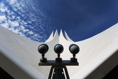 Low angle view of building against cloudy sky