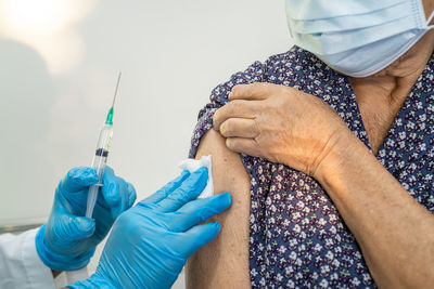 Woman taking vaccination in medical clinic