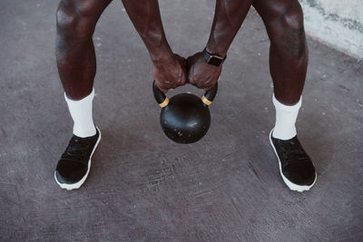 Male athlete holding kettle bell