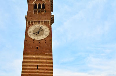 Low angle view of clock tower against sky