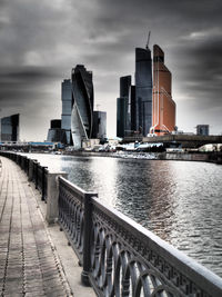 Cityscape against cloudy sky