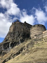 Low angle view of fort on mountain against sky