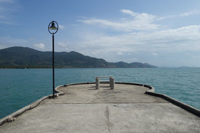 Pier over sea against sky