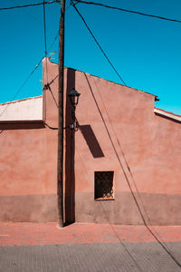 Low angle view of building against clear blue sky