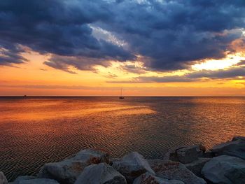 Scenic view of sea against sky during sunset