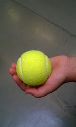 Close-up of hand holding ball