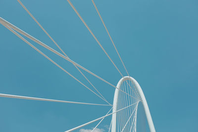 Low angle view of vapor trail against clear blue sky