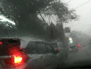 Raindrops on car window during rainy season