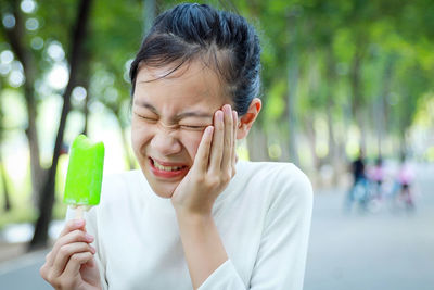 Portrait of woman holding ice cream