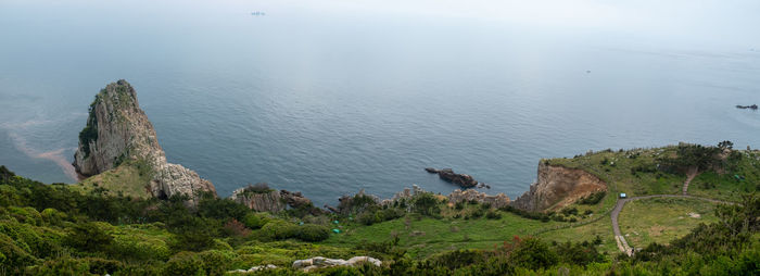High angle view of rocks by sea