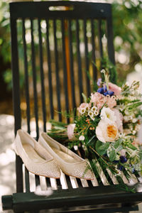 Close-up of sandal by flowering plants