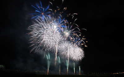 Low angle view of fireworks display at night