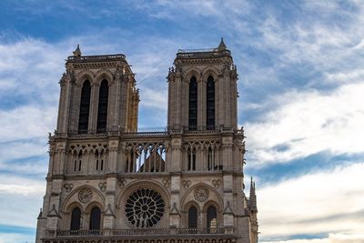 Low angle view of cathedral against cloudy sky