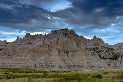 Scenic view of mountains against cloudy sky