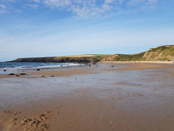 Scenic view of beach against sky