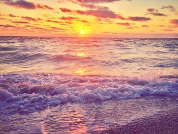 Scenic view of sea at sunset