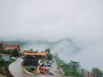 High angle view of houses and buildings against sky