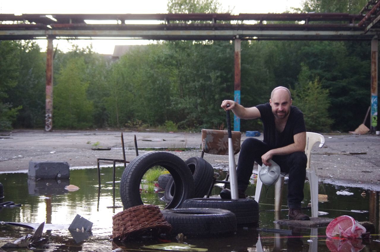 person, water, casual clothing, full length, childhood, lifestyles, bridge - man made structure, young adult, day, outdoors