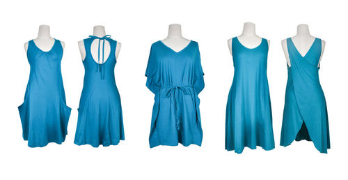 Panoramic view of clothes hanging on white background