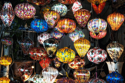 Brightly lit lanterns in hoi an night market hanging above. taken in hoi an, vietnam.