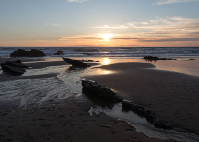Scenic view of sea against sky during sunset