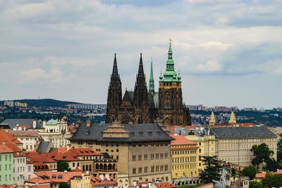 Panoramic view of buildings in city against sky