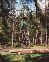 Built structure in forest against sky