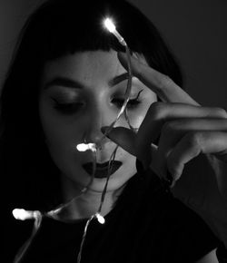 Close-up portrait of a young woman with eyes closed