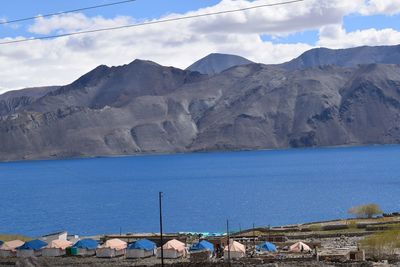 Scenic view of mountains against blue sky