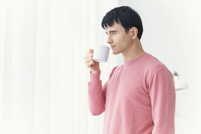 Young man drinking coffee
