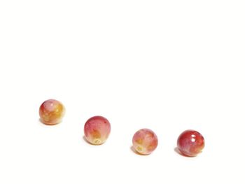 Close-up of fruits against white background