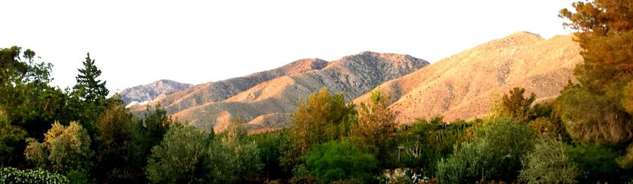 Panoramic shot of rocky mountains against clear sky