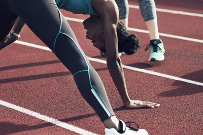 Athletes exercising on track