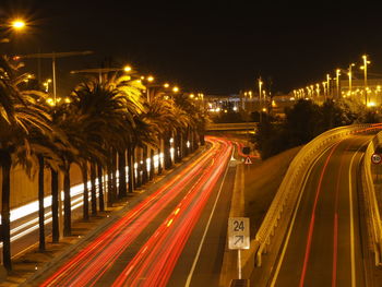 High angle view of light trails on road at night