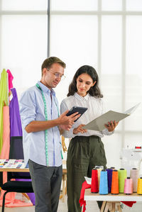 Young couple holding smart phone