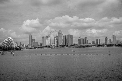 Cityscape against cloudy sky