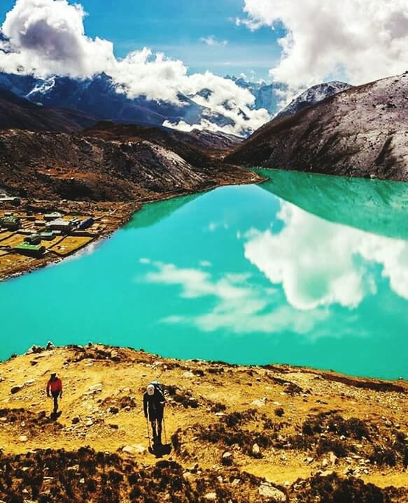 sky, cloud - sky, cloud, tranquility, landscape, mountain, cloudy, tranquil scene, nature, scenics, blue, beauty in nature, day, water, lake, rock - object, standing, non-urban scene