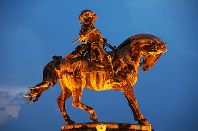 Low angle view of statue against sky