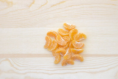 Close-up of orange on wooden table