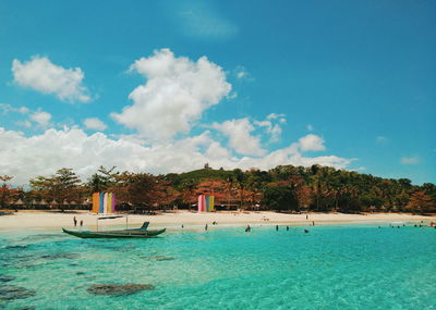 Scenic view of swimming pool by sea against sky