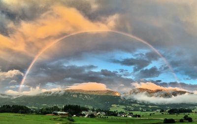 Scenic view of rainbow against sky during sunset