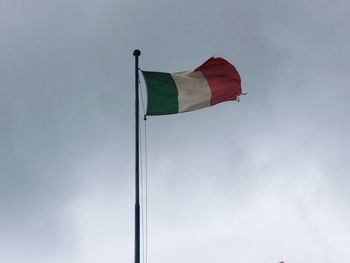 Low angle view of flag against sky