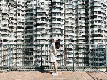 Woman standing in front of a building