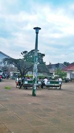 View of street light against cloudy sky