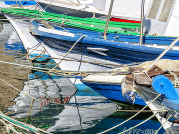 High angle view of fishing boats moored at harbor