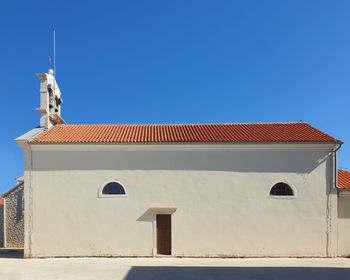 Side view of st. roko church against clear blue sky located in bibinje, croatia